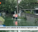 Sigue inundado pero colonos de la Azteca regresan a sus casas